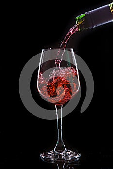 Red wine pouring into a wine glass