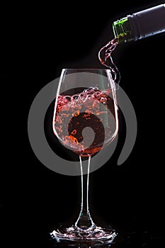 Red wine pouring into a wine glass