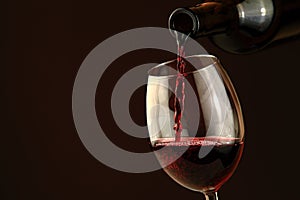 Red wine pouring into a wine glass