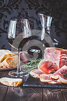 Red wine with prosciutto ham