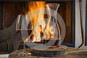 Red wine relaxing fireplace in autumn winter