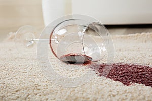 Red Wine Spilled From Glass On Carpet
