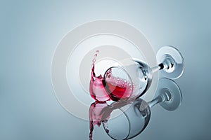 Red wine spilled out of a falling glass