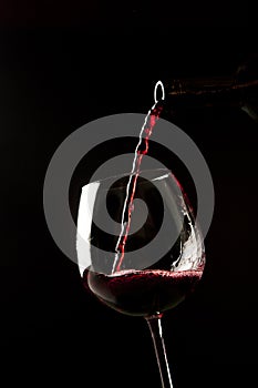 Red wine splash on a glass