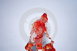 Red wine splash on white background