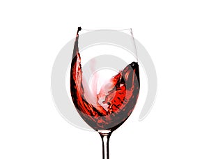 Red wine splashing in a glass, isolated on white