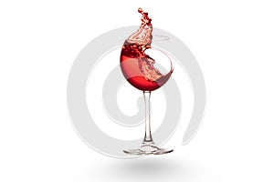 Red wine splashing out of a wine glass, isolated on white