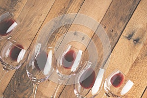 Red wine in transparent wine glasses on a wooden background. Bojole nouveau, wine bar, winery, winemaking, wine tasting concept,