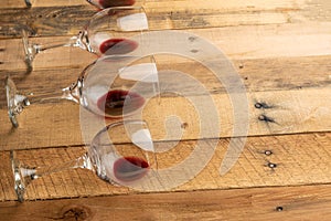 Red wine in transparent wine glasses on a wooden background. Bojole nouveau, wine bar, winery, winemaking, wine tasting concept,