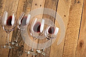 Red wine in transparent wine glasses on a wooden background. Bojole nouveau, wine bar, winery, winemaking, wine tasting concept,