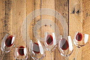 Red wine in transparent wine glasses on a wooden background. Bojole nouveau, wine bar, winery, winemaking, wine tasting concept,