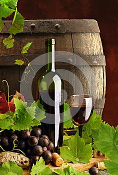 Red wine with vine and cask