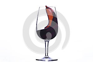 Red wine wave in a glass isolated