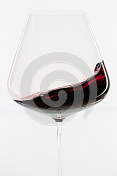 Red wine waving in the glass