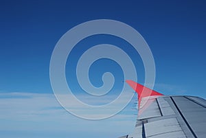 Red wing plane on blue sky