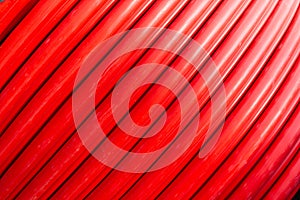 Red wire cable in reels close up background