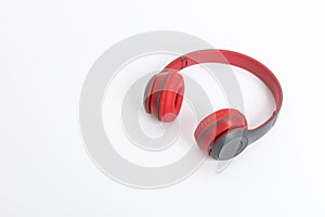 Red wireless headphone on white background.