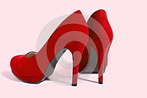 Red Woman Fashion High Heels Shoes Isolated On Pink Background. Closeup women bright summer footwear. Shopping and Fashion concept