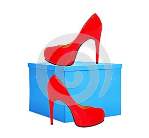 Red woman shoe and blue gift box isolated on white