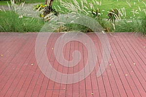 Red wood plank patio floor in outdoor garden