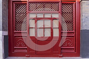 Red wood window and door, decoration colorful painting beam and wood pole from ancient china palace in forbidden City, Beijing,