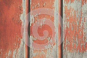 Red wooden background. Wooden background, painted surface of the old red boards. Weathered red wood texture close-up.