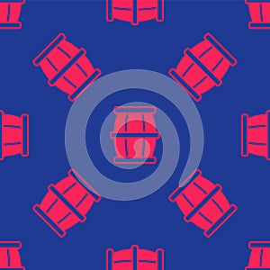 Red Wooden barrel with honey icon isolated seamless pattern on blue background. Vector