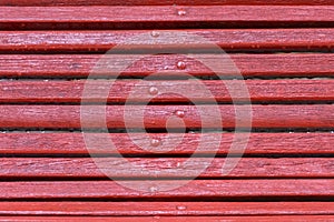 Red wooden bench close-up