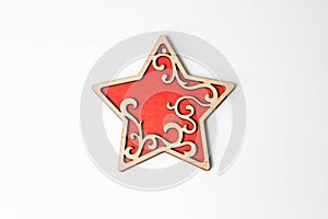 Red wooden christmas star ornament on white