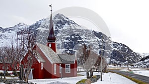 Red wooden church in Flakstad on the Lofoten islands in winter