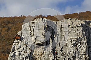 Red wooden climber house in the Lakatnik rocks and Alpine climber, Iskar river defile, Sofia province