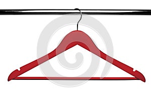 Red Wooden clothes hanger on metal crossbar isolated over white.