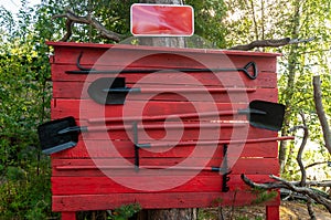 Red wooden fire shield with tools