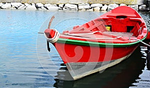 Red Wooden Fishing Boat Floating