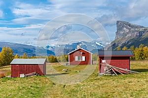 Red wooden house in arctic wilderness. Aktse mountain cabin deep in Sarek National Park, Sweden. Antlers on the wall