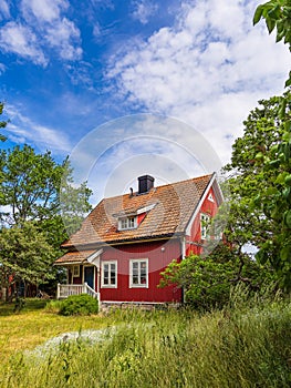 Red wooden house on the island Ã–land in Sweden