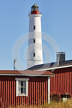 Red wooden houses lighthouse, Ã§Ã§Ã§Ã§xxHailuoto island. Marjaniemi beach. Finland