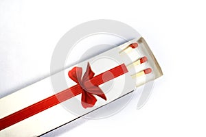 Red wooden matches in matchbox