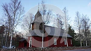Red wooden traditional Oxberg chapel near Mora in Dalarna, Sweden