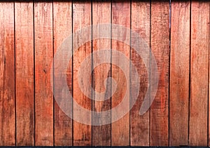 Red wooden wall in natue light, texture of plank wall