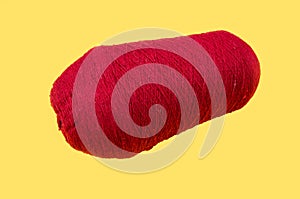Red wool knitting yarn. Woolen thread for knitting. Own hand. Knitting and needlework. Yarn for a scarf, sweater and socks on a ye