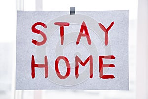 Red word stay home on paper