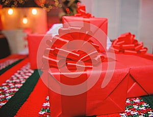 Red wrapped gifts or presents. Prepare for christmas and new year. Wrapping gifts concept. Magic moments. Prepare