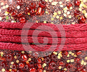 Red wrapping cords on shine background