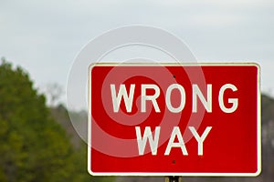 Red Wrong Way Sign on the Road