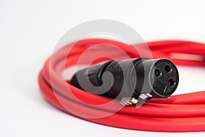 Red xlr microphone cable on the white background