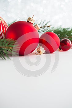 Red xmas ornaments on wooden background. Merry christmas card.