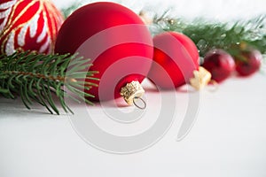 Red xmas ornaments on wooden background. Merry christmas card.