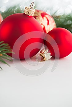 Red xmas ornaments on wooden background. Merry christmas card.