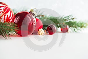 Red xmas ornaments on wooden background. Merry christmas card.